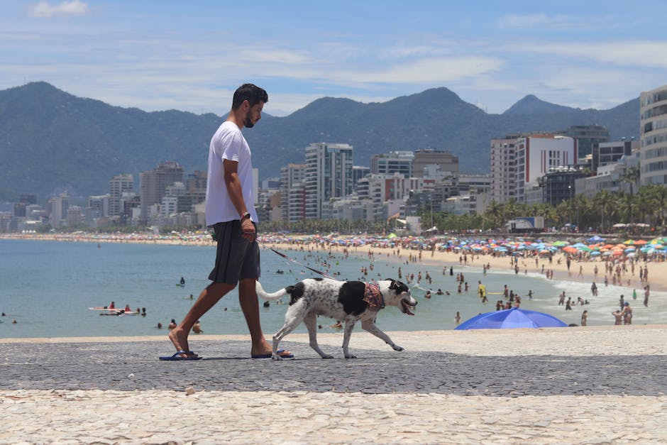 Brazilian man wearing light shirt and shorts on beach