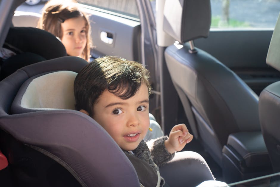 children playing in car road trip