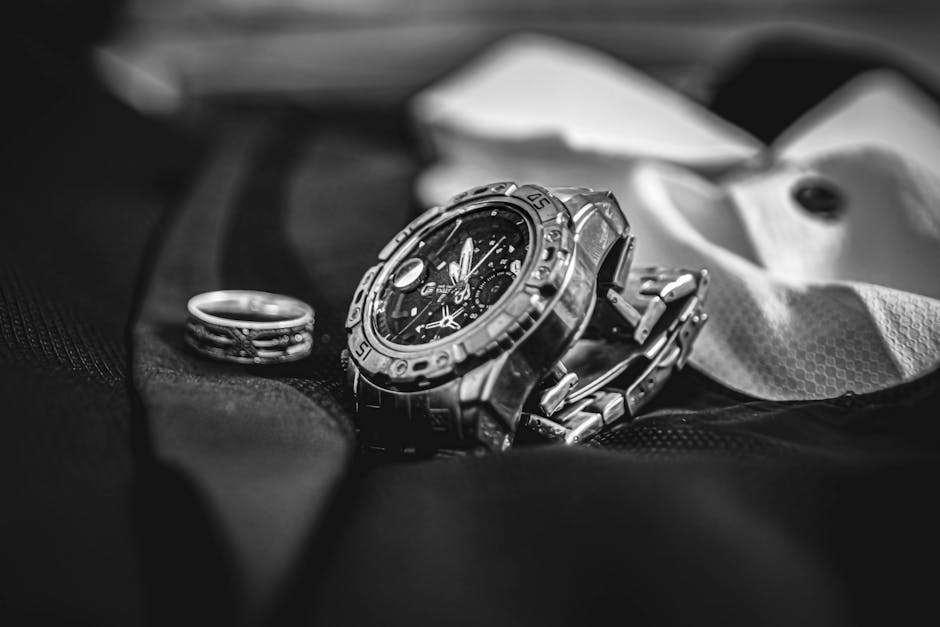 close up of elegant minimalist accessories like watch and rings