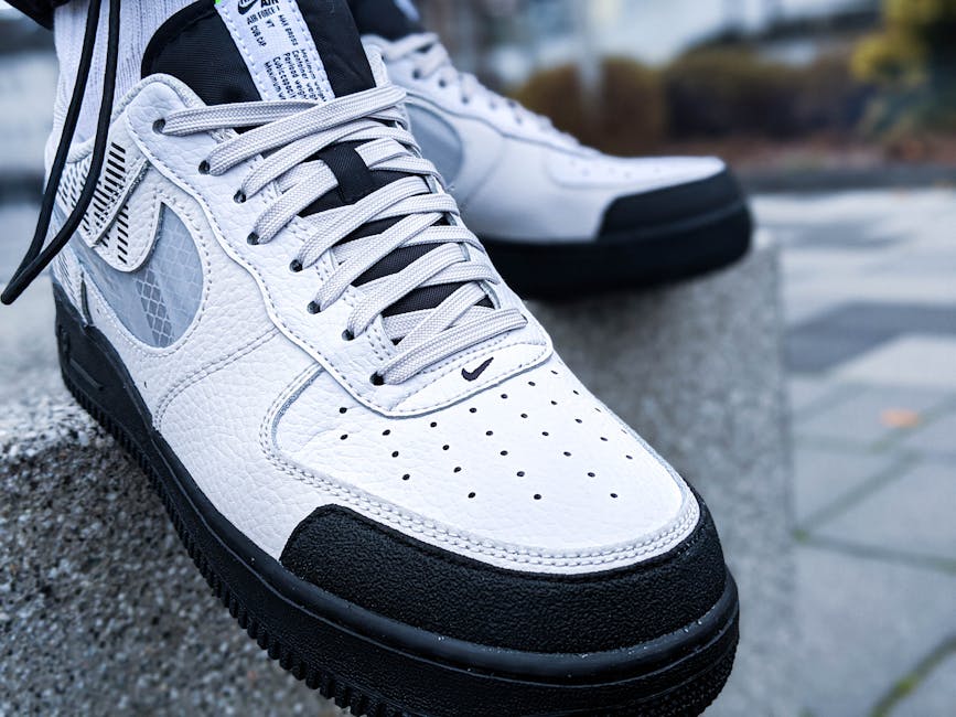 close-up of stylish sneakers and accessories on a street