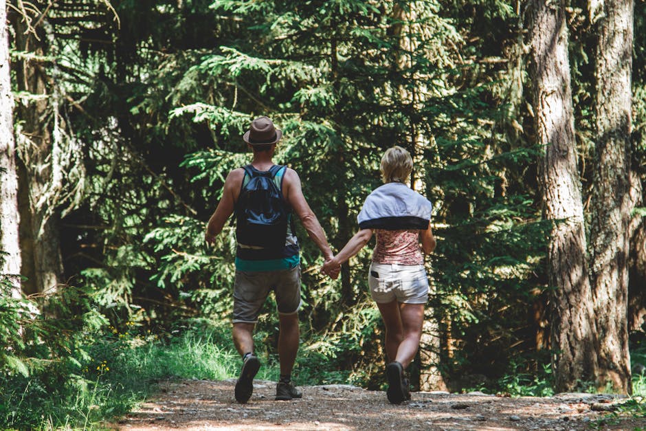 Couple hiking forest path