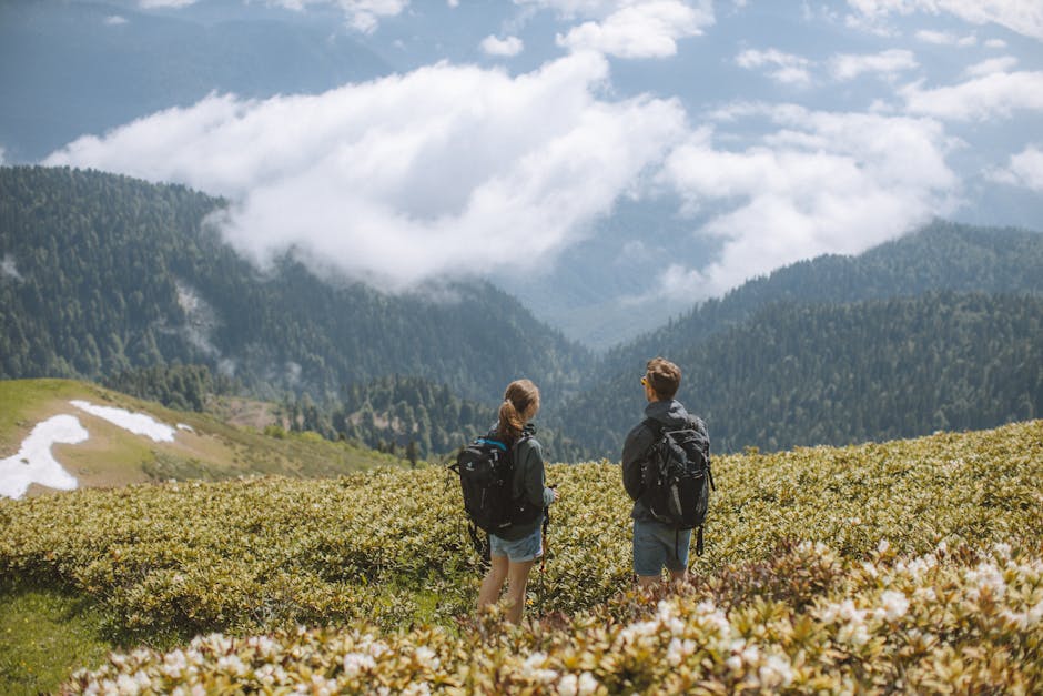 Couple hiking in lush green mountains