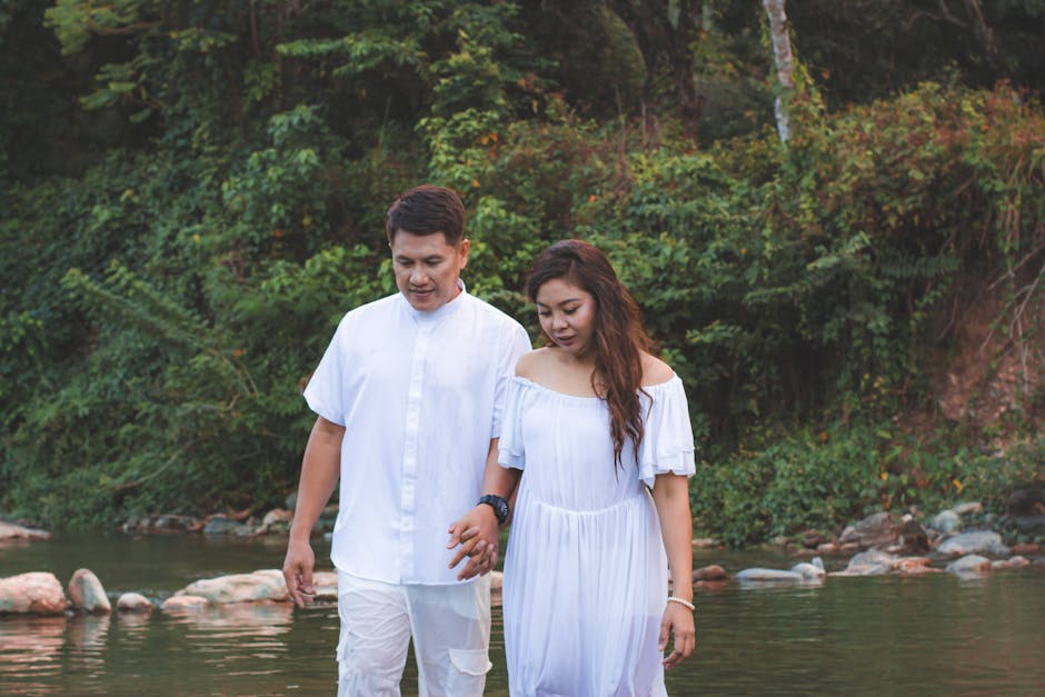 couple picnicking by a river