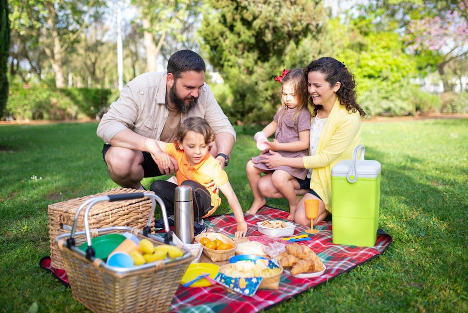 family eating picnic blanket