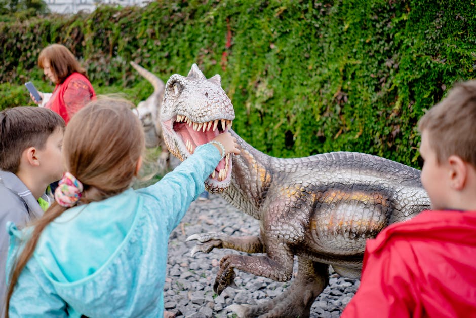kids exploring dinosaur park