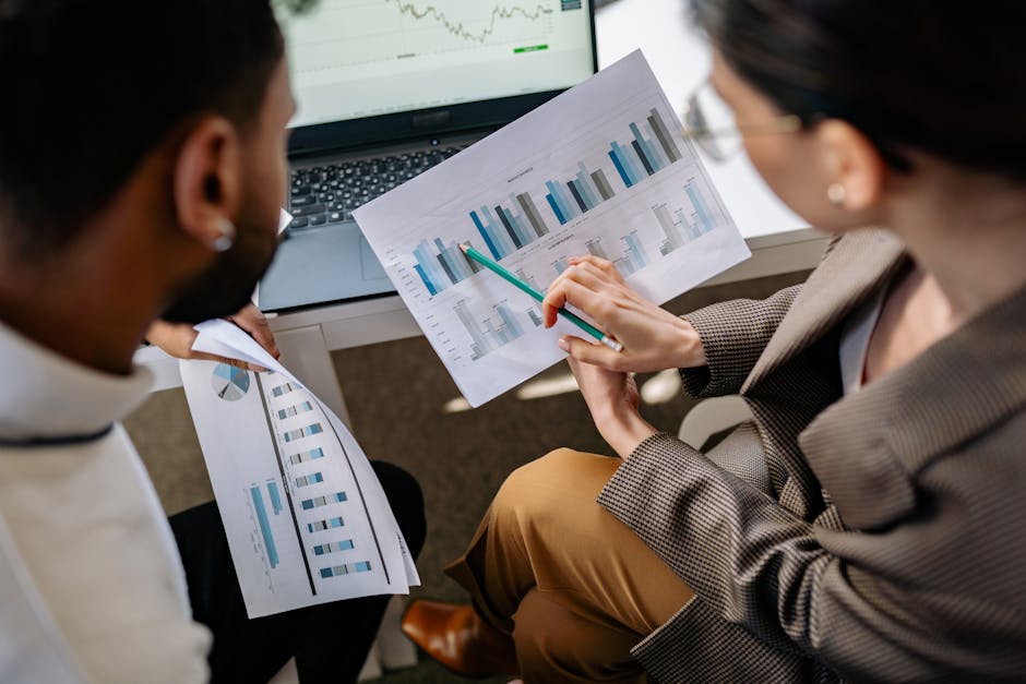 man and woman discussing data in office