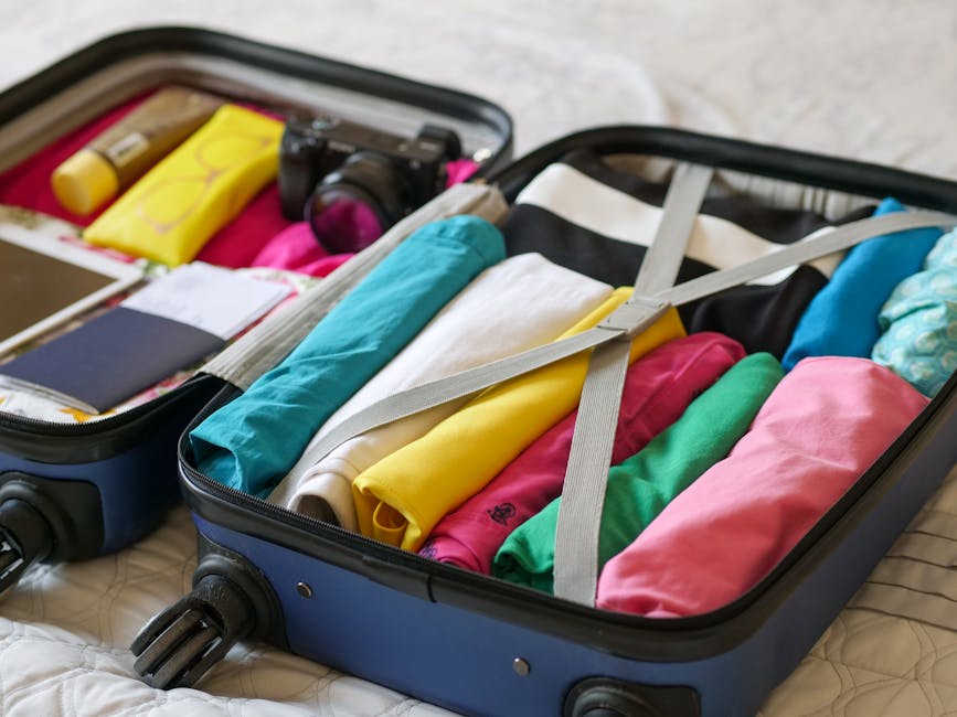 Opened travel backpack with organized items