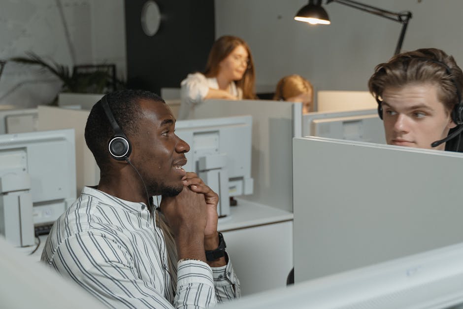 people collaborating with AI assistants in modern office