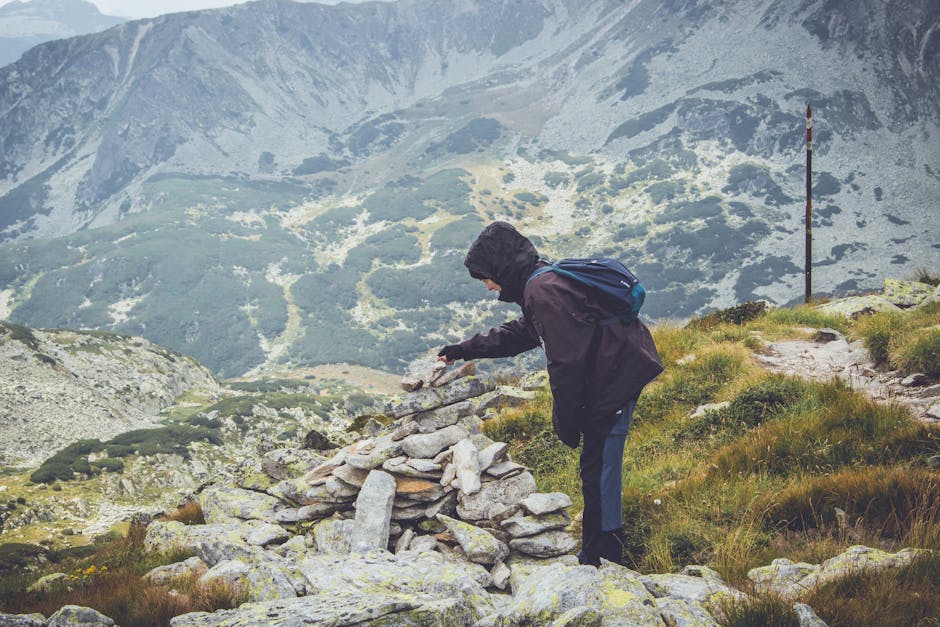 person hiking in scenic mountain landscape