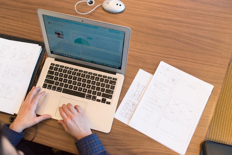 person organizing documents with digital tools