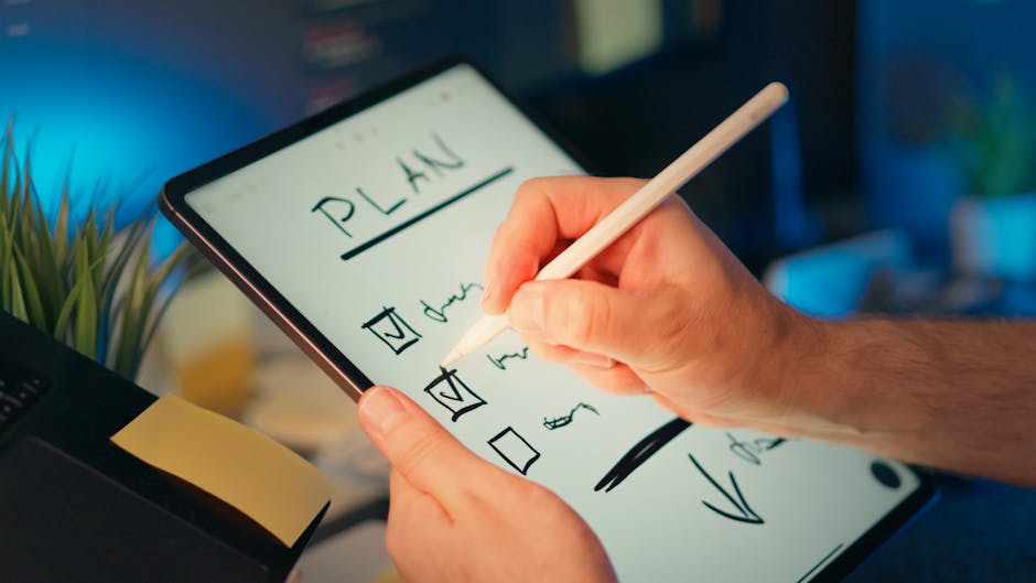 person organizing tasks on tablet