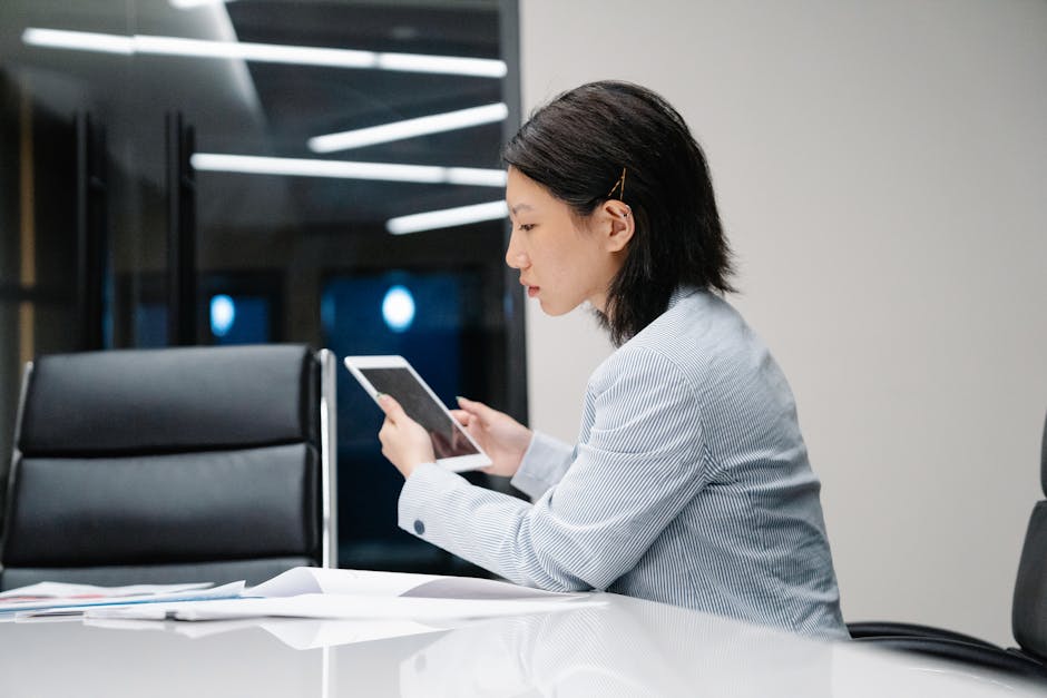 person using tablet at desk