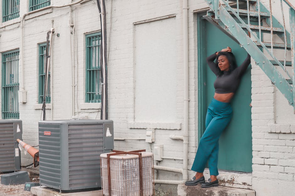 person wearing stylish wide leg pants and simple top in urban setting