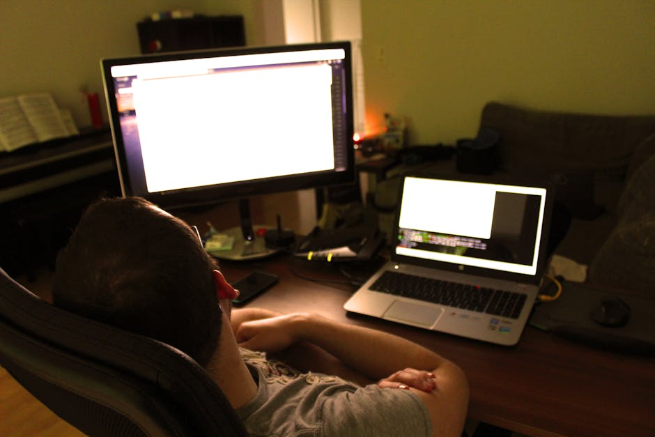 person working efficiently with multiple screens