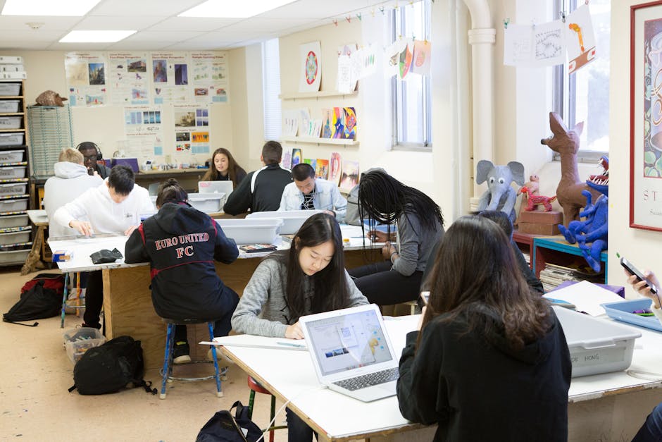 students collaborating on a tech project in a modern classroom