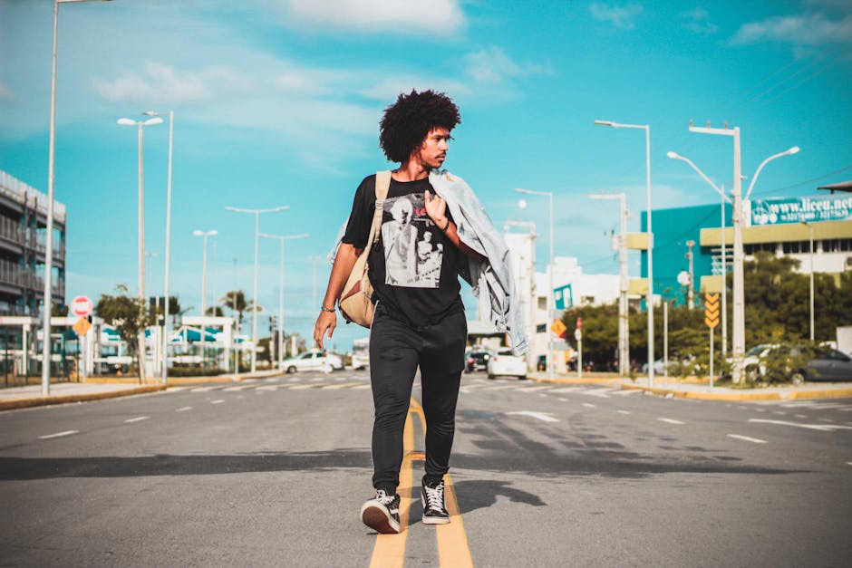 Stylish Brazilian man walking in sunny city