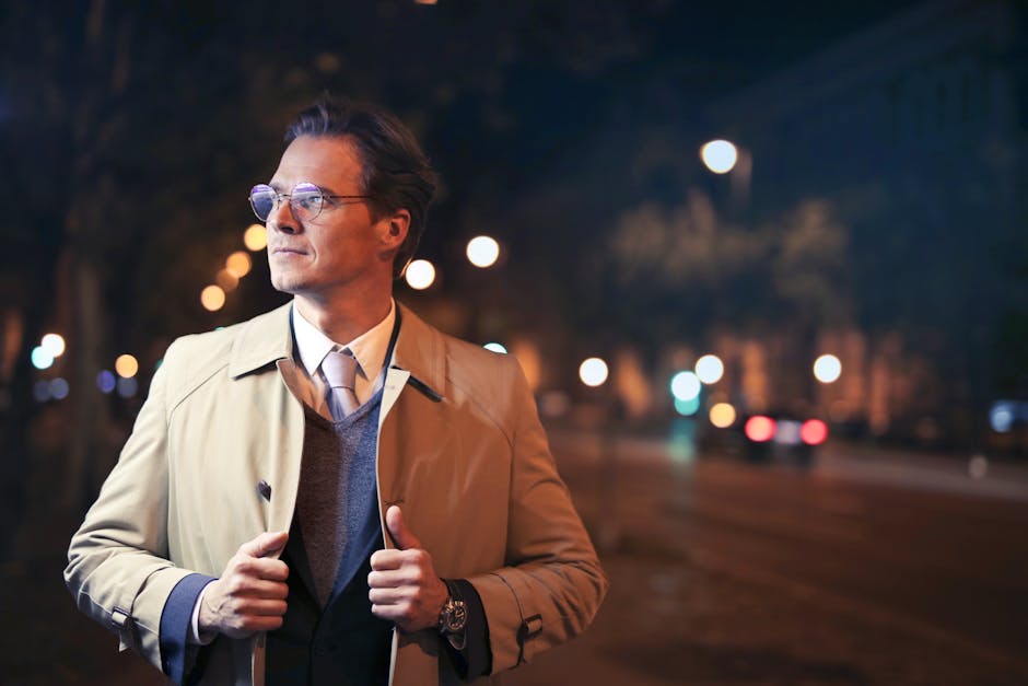 Stylish person layering clothes in a city street
