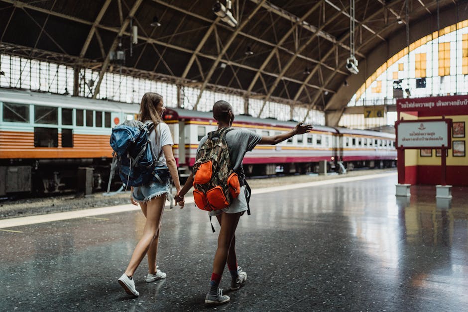 traveler walking train station with backpack