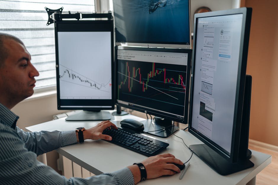 woman analyzing data on multiple screens