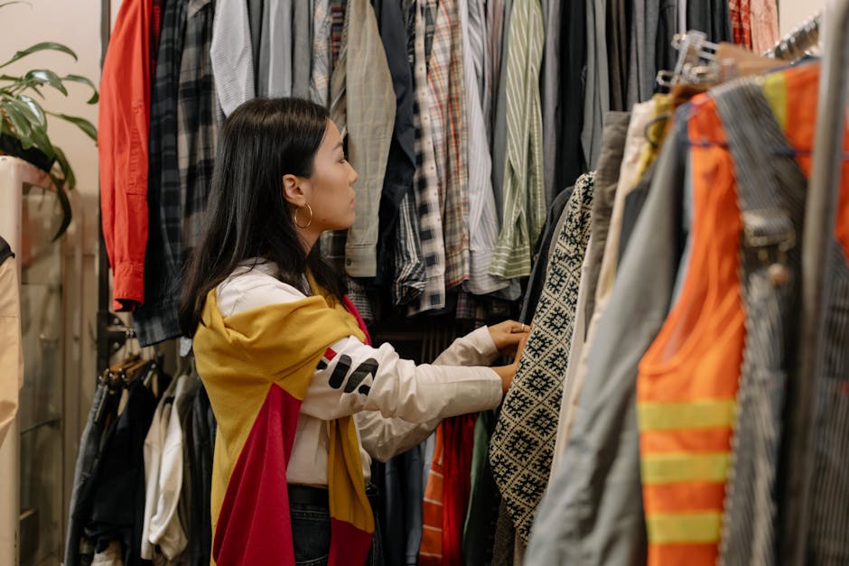 woman browsing second hand clothes in a store
