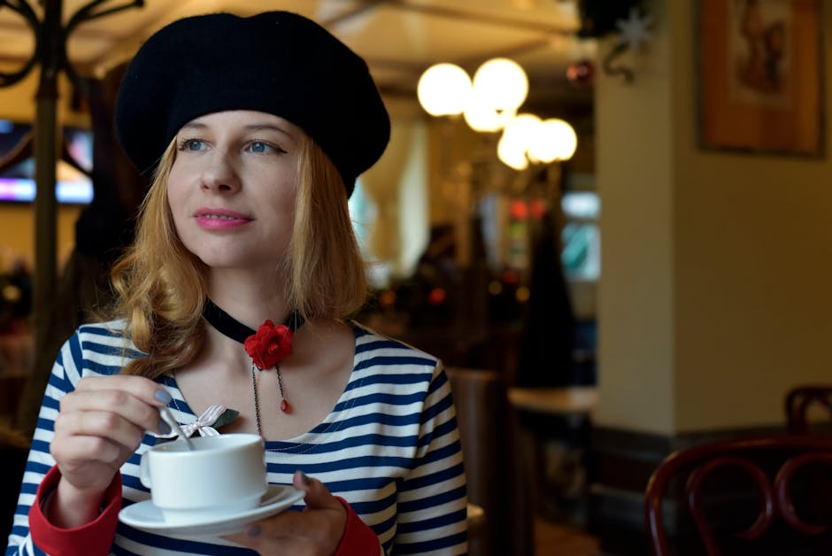 woman drinking coffee on parisian cafe terrace