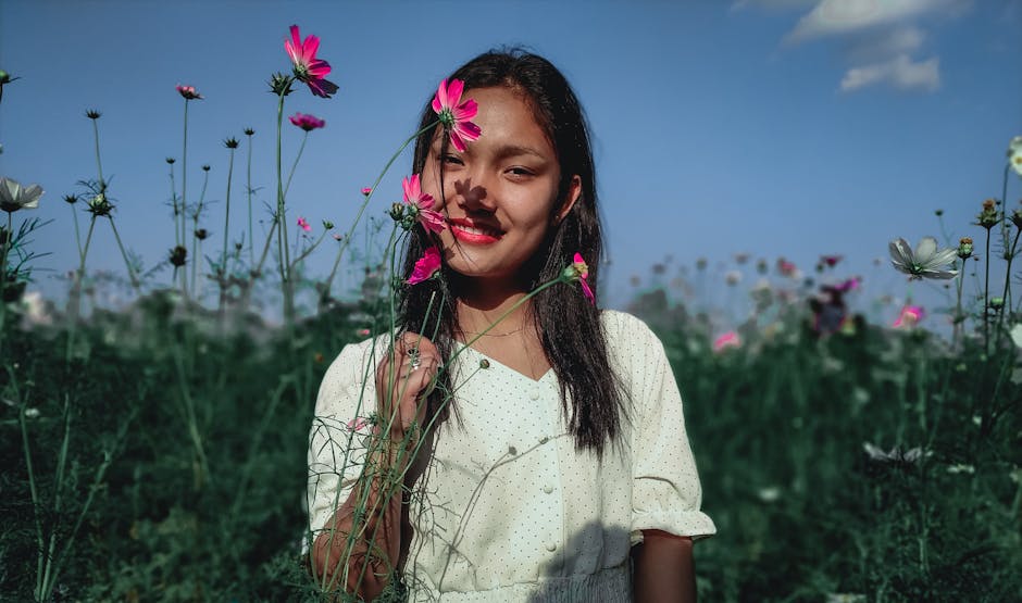woman enjoying spring in flower field