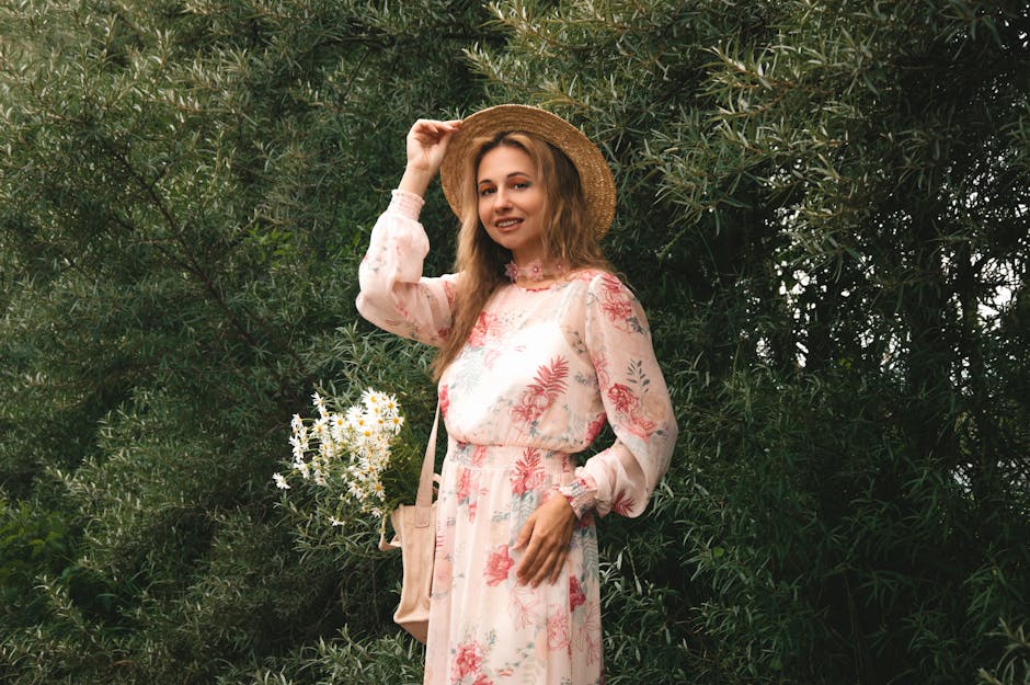 woman in floral maxi dress with straw hat