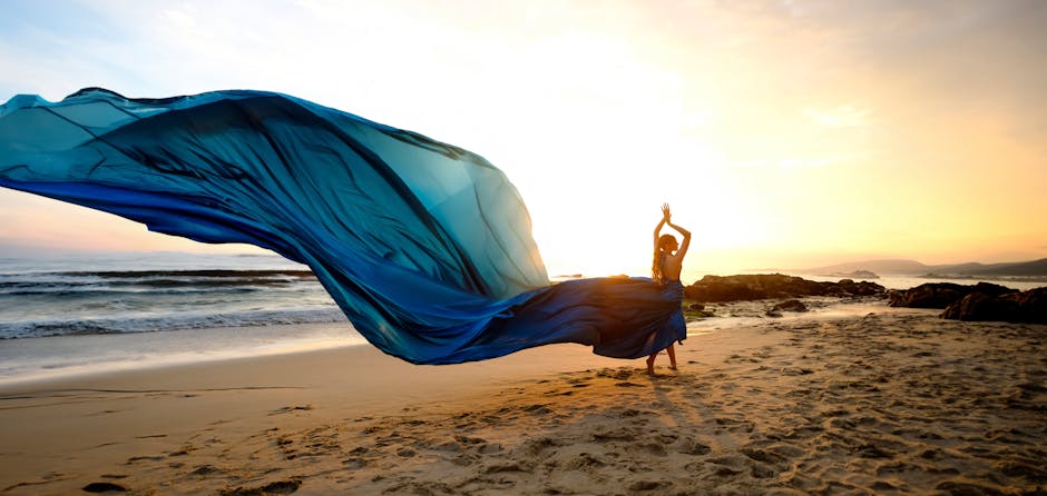 woman in flowing dress on beach