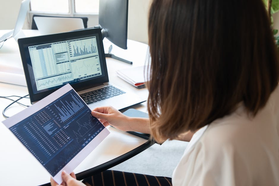 woman looking at data analytics on screen in poland