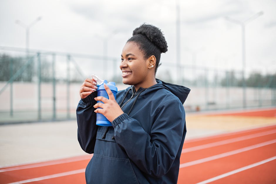 woman smiling drinking water train