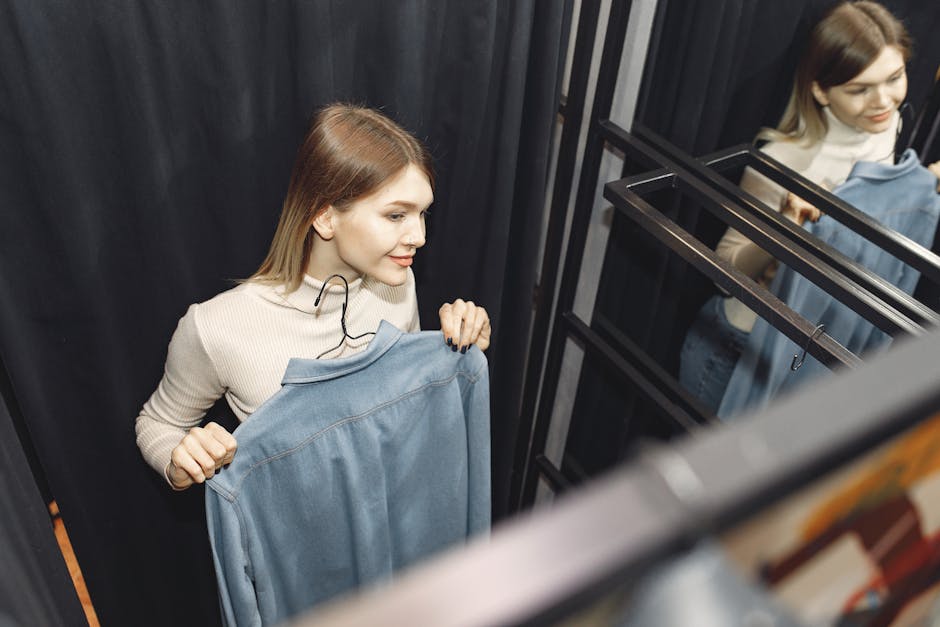 woman trying on clothes in a modern fitting room
