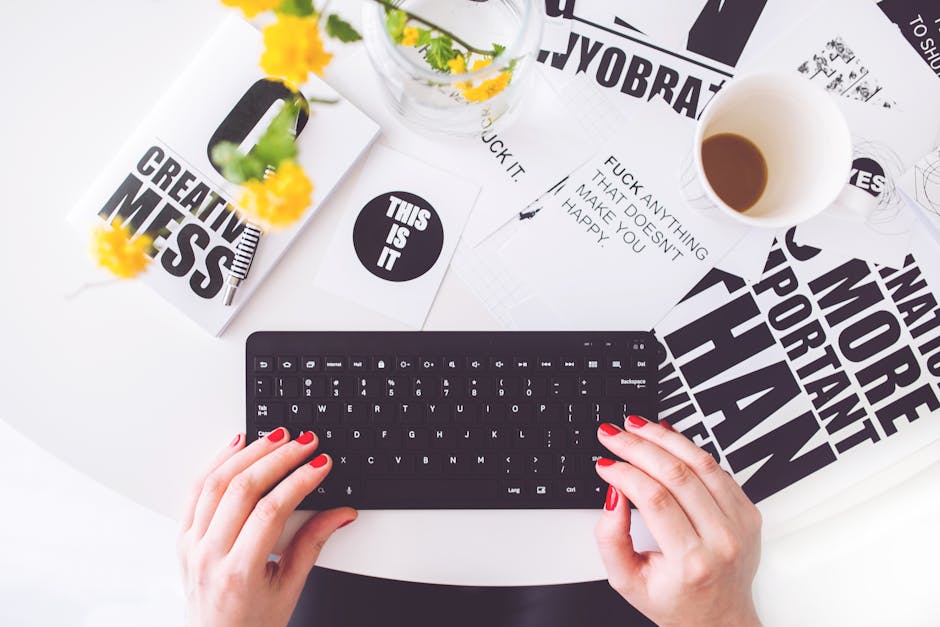woman typing on keyboard with creative graphics