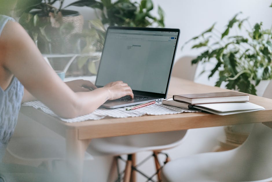 woman using AI writing tool on laptop