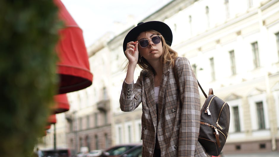 woman walking in city street, wearing stylish casual outfit