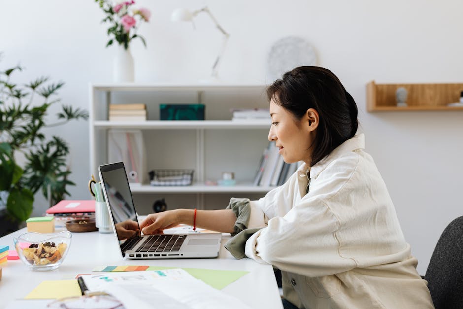 Woman working on laptop in modern office