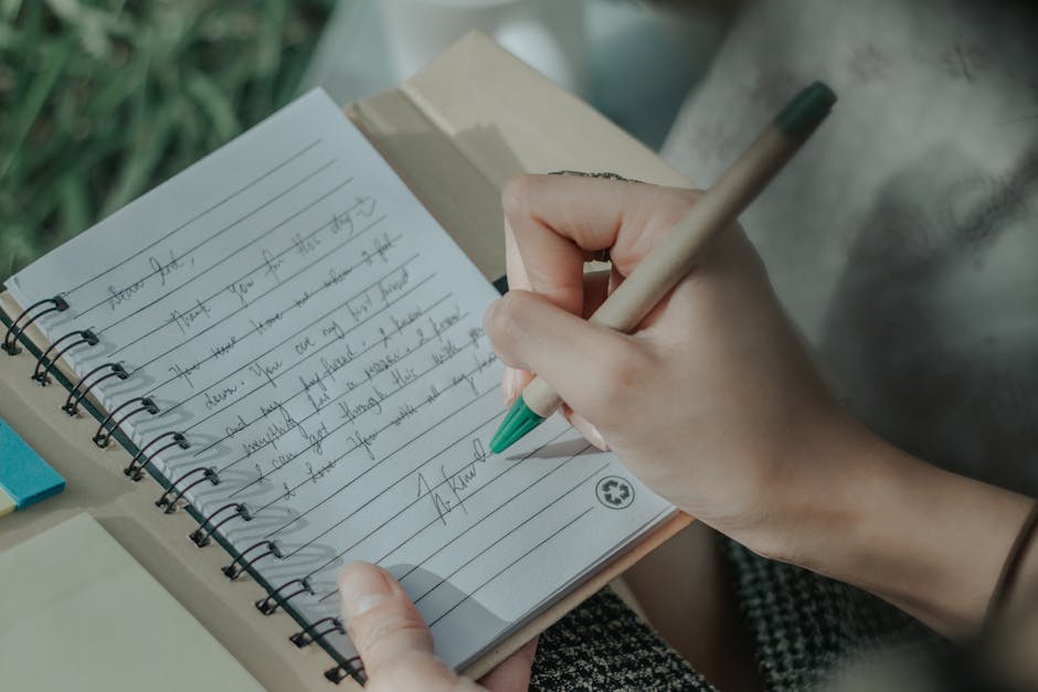 woman writing notebook